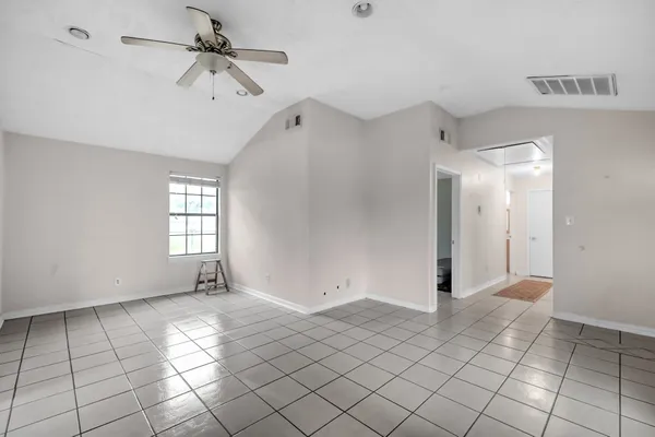 a kitchen with stainless steel appliances granite countertop a stove and a refrigerator