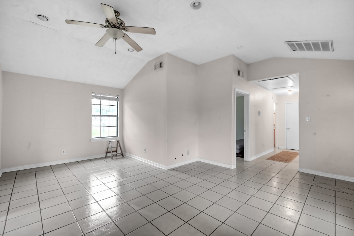 7644 Spring Cypress Road Spring, TX 77379 - Photo 12 of 28 a view of an empty room with a window