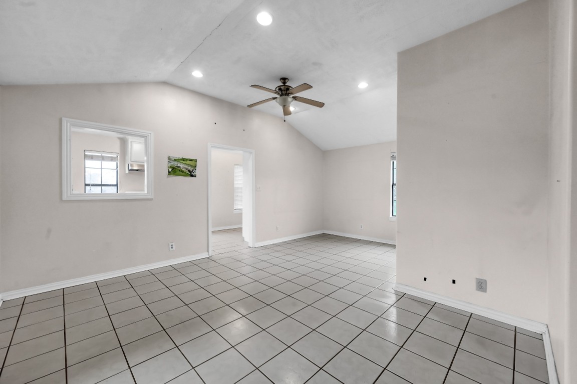 7644 Spring Cypress Road Spring, TX 77379 - Photo 18 of 28 wooden floor in an empty room with a window