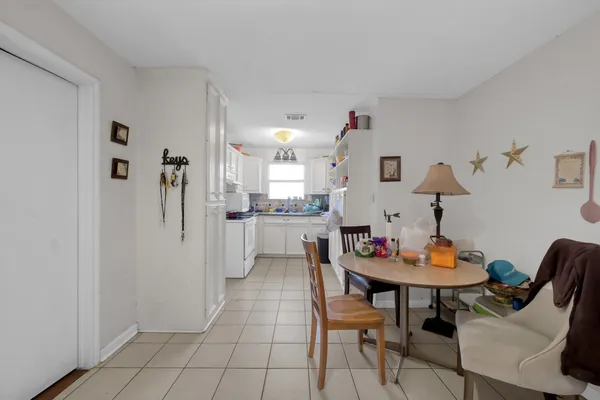 a kitchen with a refrigerator and a stove