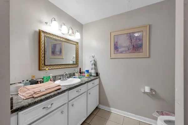 a kitchen with stainless steel appliances a white cabinets and a refrigerator