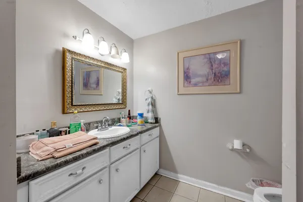 a kitchen with stainless steel appliances cabinets and a window