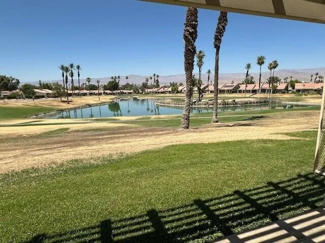 a view of a swimming pool with an ocean view