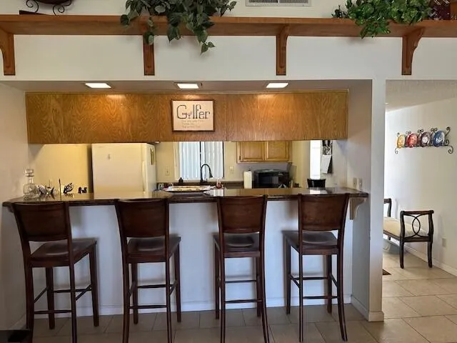 a kitchen with a dining table and chairs