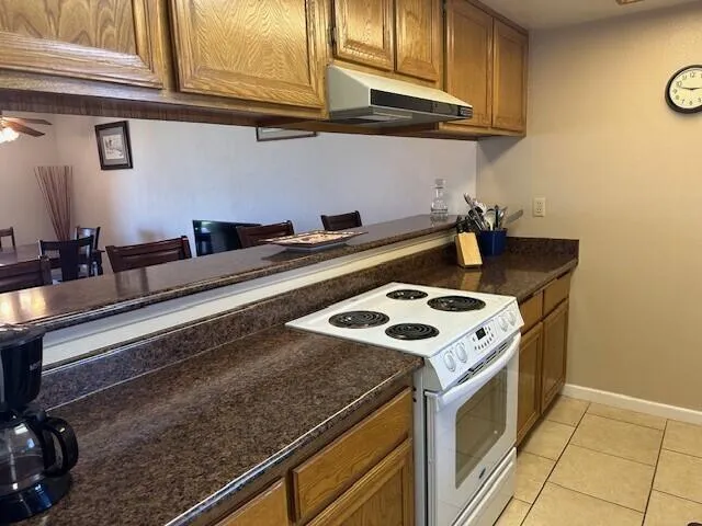 a kitchen with a stove and a sink