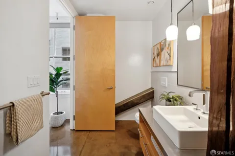 a bedroom with a bed and a couch