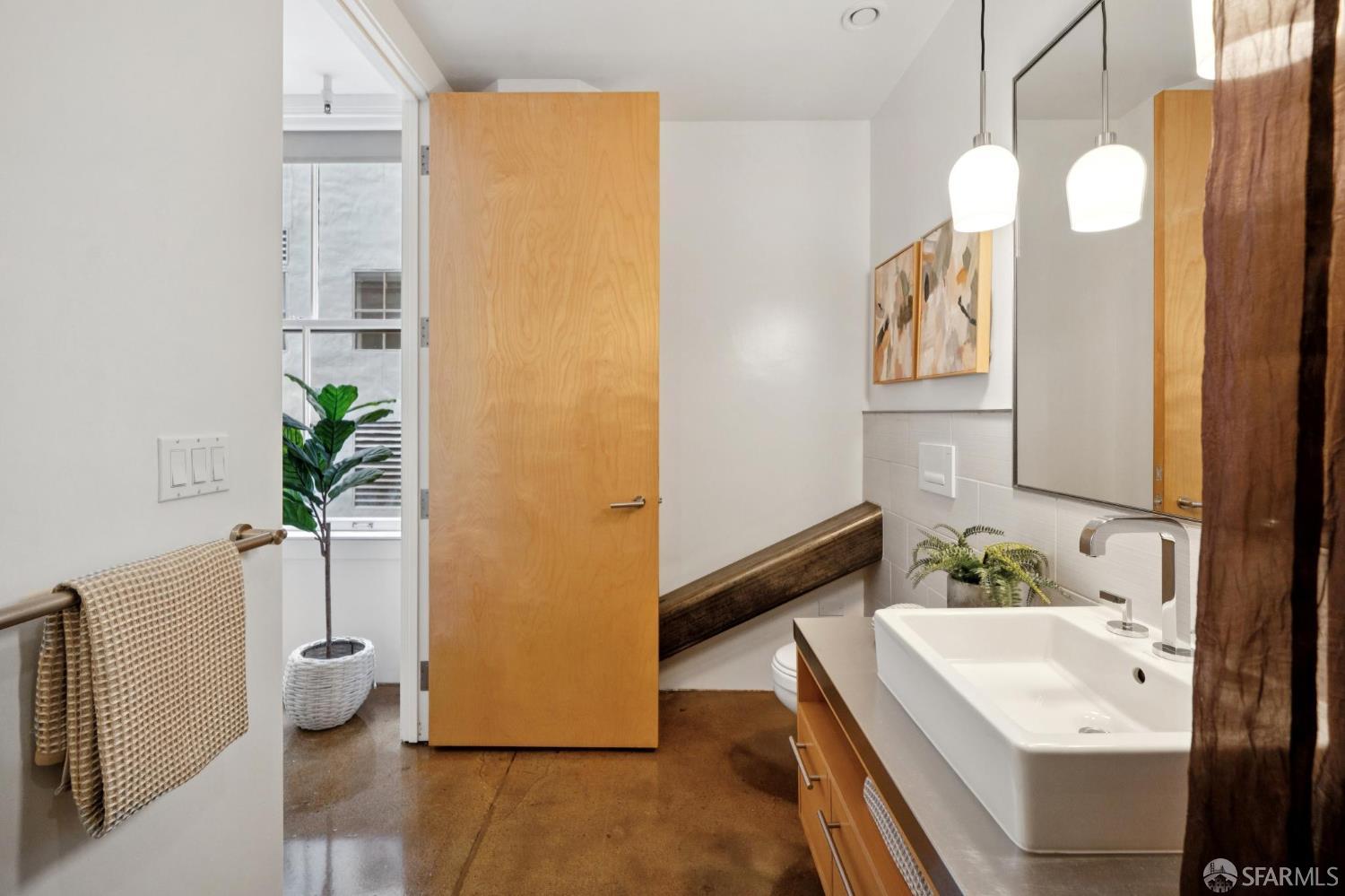 2 Mint Plaza, Unit 201 San Francisco, CA 94103 - Photo 22 of 40 a bathroom with a tub sink and mirror