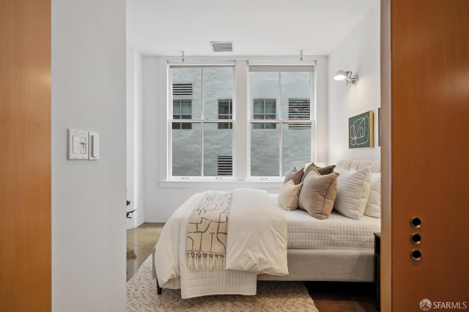 2 Mint Plaza, Unit 201 San Francisco, CA 94103 - Photo 24 of 40 a bedroom with a bed and a window