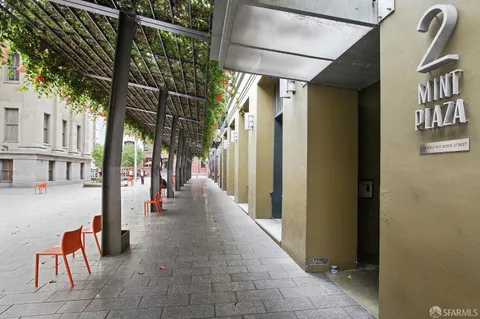 a hallway with sliding door and wooden stairs