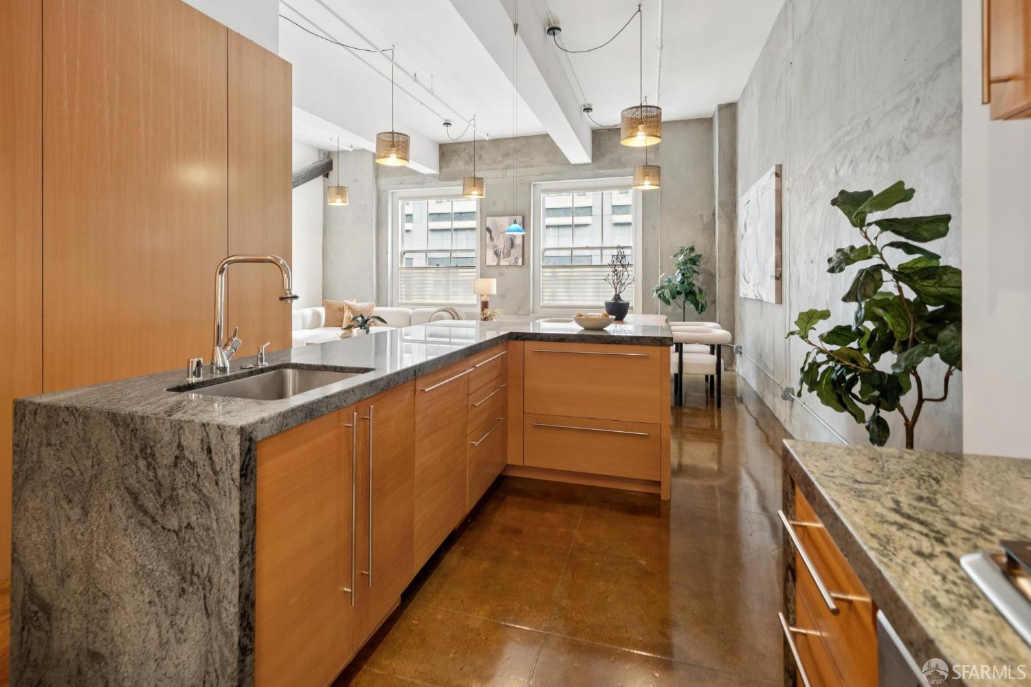 2 Mint Plaza, Unit 201 San Francisco, CA 94103 - Photo 7 of 40 a kitchen with stainless steel appliances granite countertop sink stove and cabinets