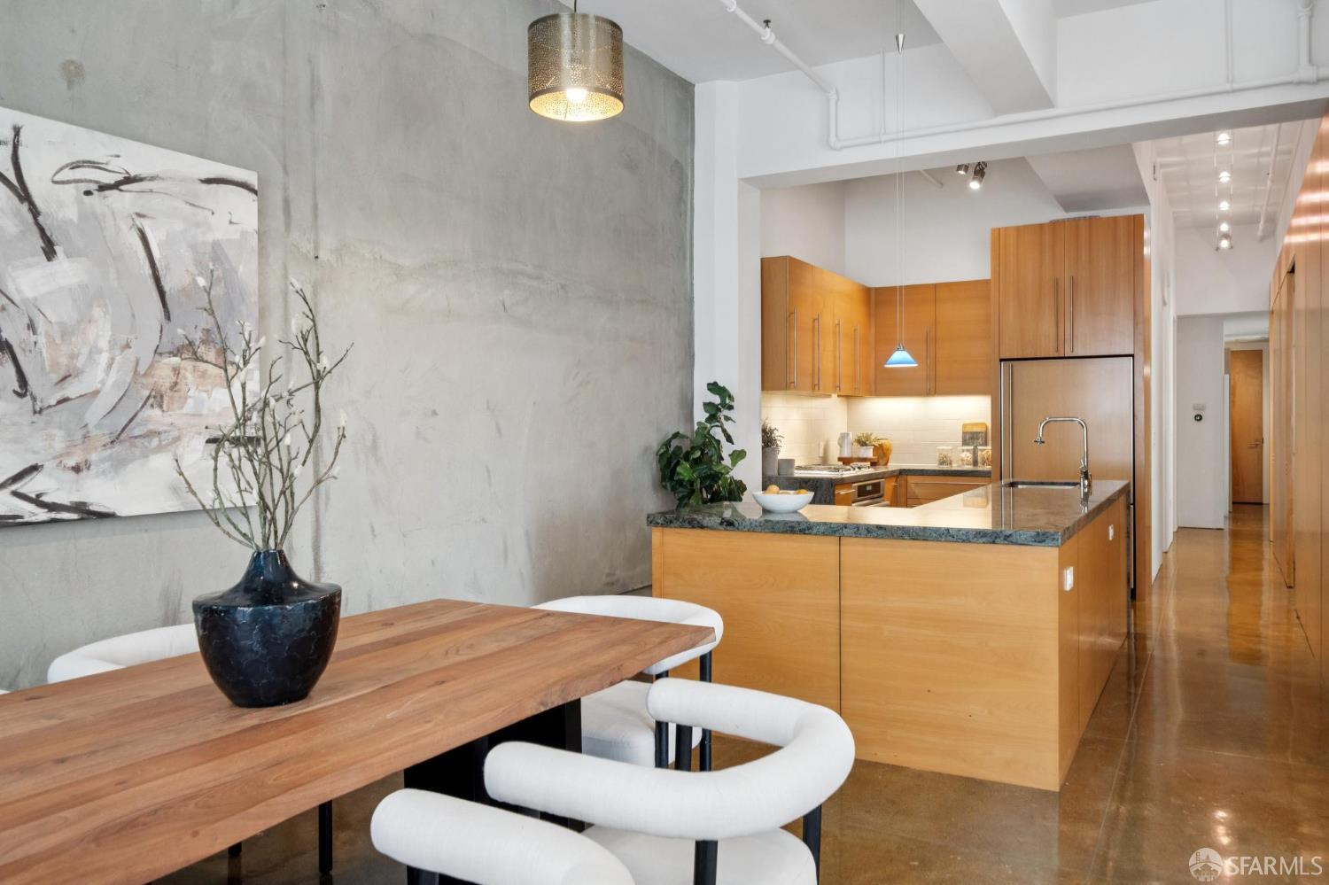 2 Mint Plaza, Unit 201 San Francisco, CA 94103 - Photo 10 of 40 a kitchen with a table and chairs in it