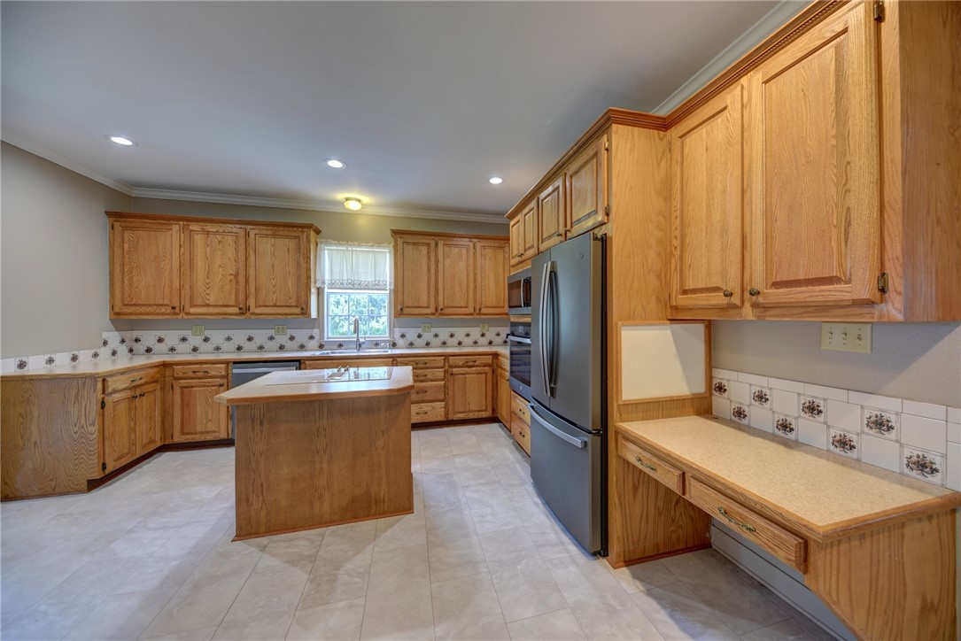 2375 FM 2935 Road North Brenham, TX 77833 - Photo 24 of 47 a kitchen with stainless steel appliances granite countertop a refrigerator sink and cabinets