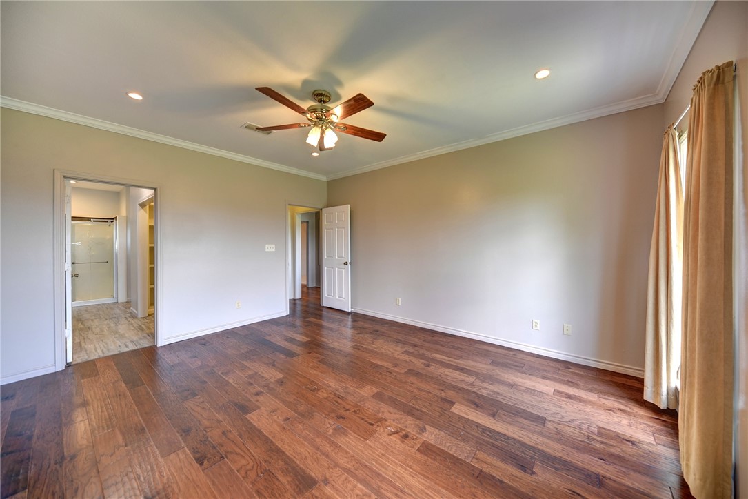 2375 FM 2935 Road North Brenham, TX 77833 - Photo 27 of 47 a view of an empty room with wooden floor and a window