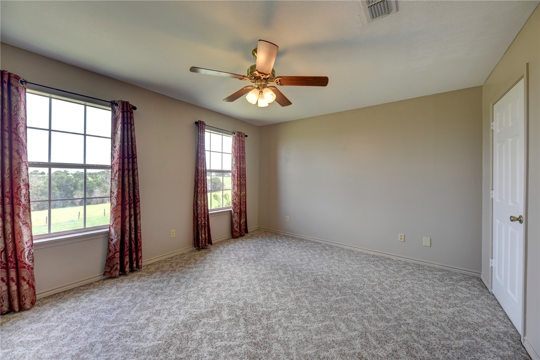 2375 FM 2935 Road North Brenham, TX 77833 - Photo 29 of 47 an empty room with windows and fan