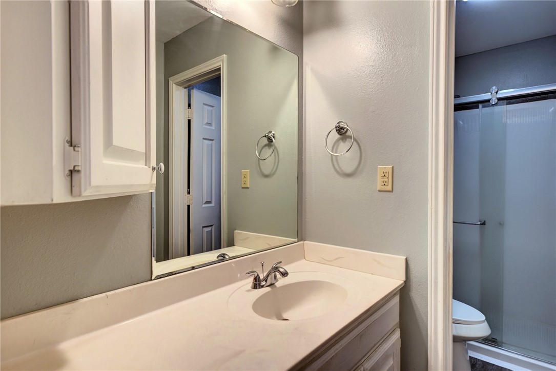 2375 FM 2935 Road North Brenham, TX 77833 - Photo 31 of 47 a bathroom with a sink vanity and a mirror