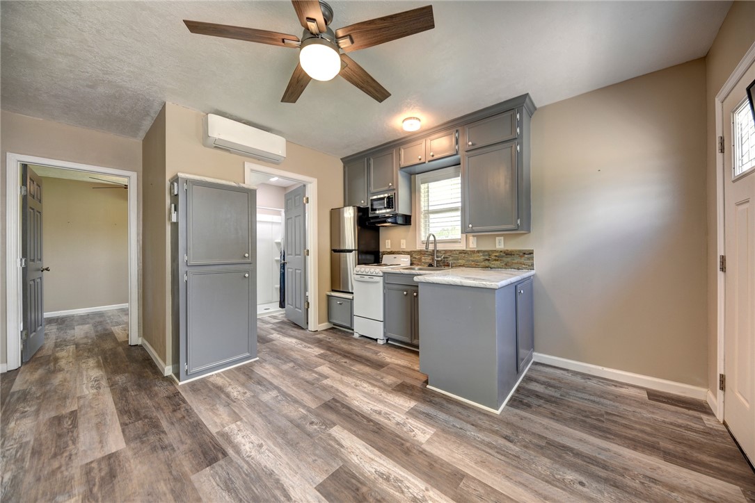 2375 FM 2935 Road North Brenham, TX 77833 - Photo 35 of 47 a kitchen with a refrigerator and a sink