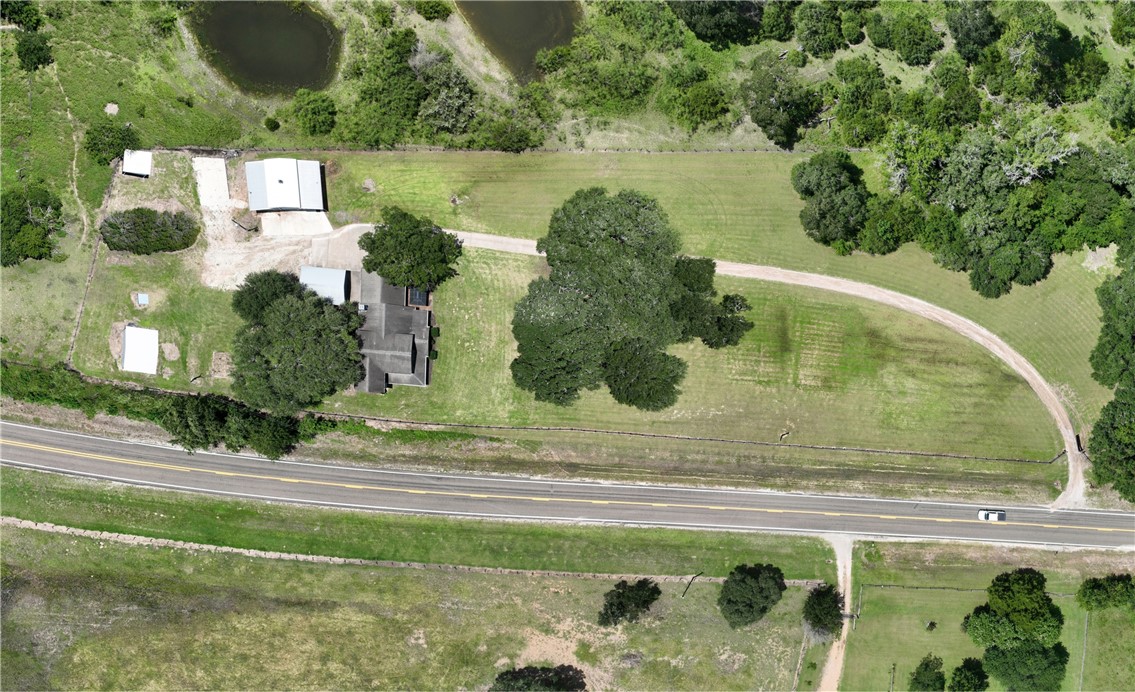 2375 FM 2935 Road North Brenham, TX 77833 - Photo 4 of 47 a view of a yard in front of the house