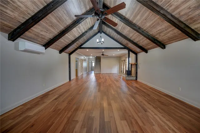 a view of room with wooden floor