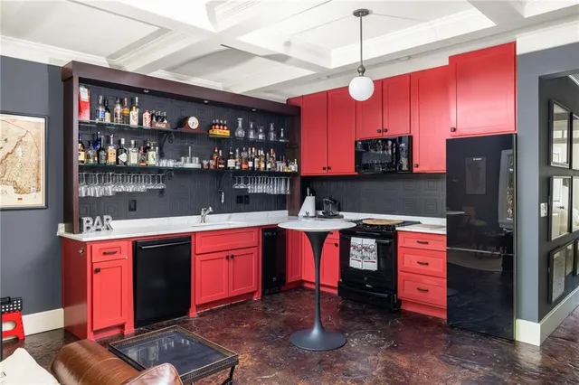 a kitchen with stainless steel appliances granite countertop a stove refrigerator and cabinets