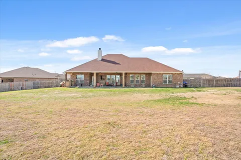 a house with swimming pool in front of it