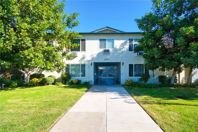 a front view of a house with yard