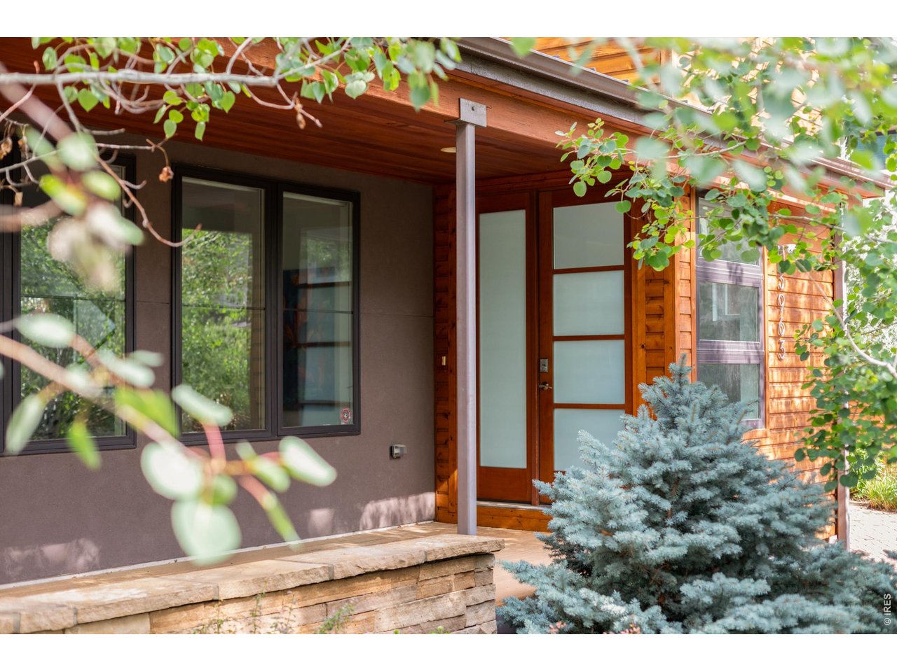 3963 Springleaf Lane Boulder, CO 80304 - Photo 30 of 32 A spacious covered front porch creates a warm first impression before the home opens into a bright, airy main floor with a contemporary feel.