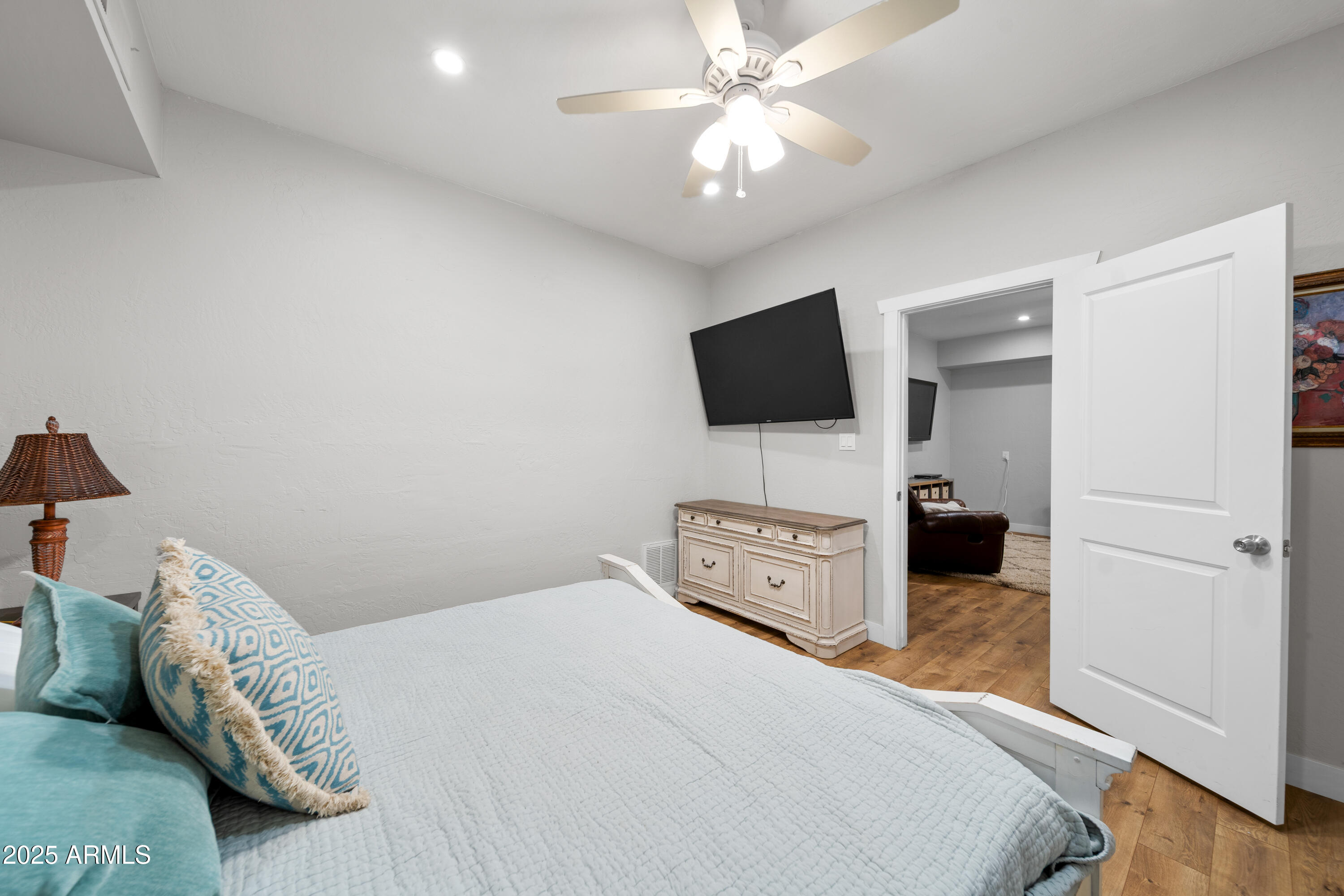 1898 Highway 260 Overgaard, AZ 85933 - Photo 14 of 38 a bedroom with a bed and a flat screen tv