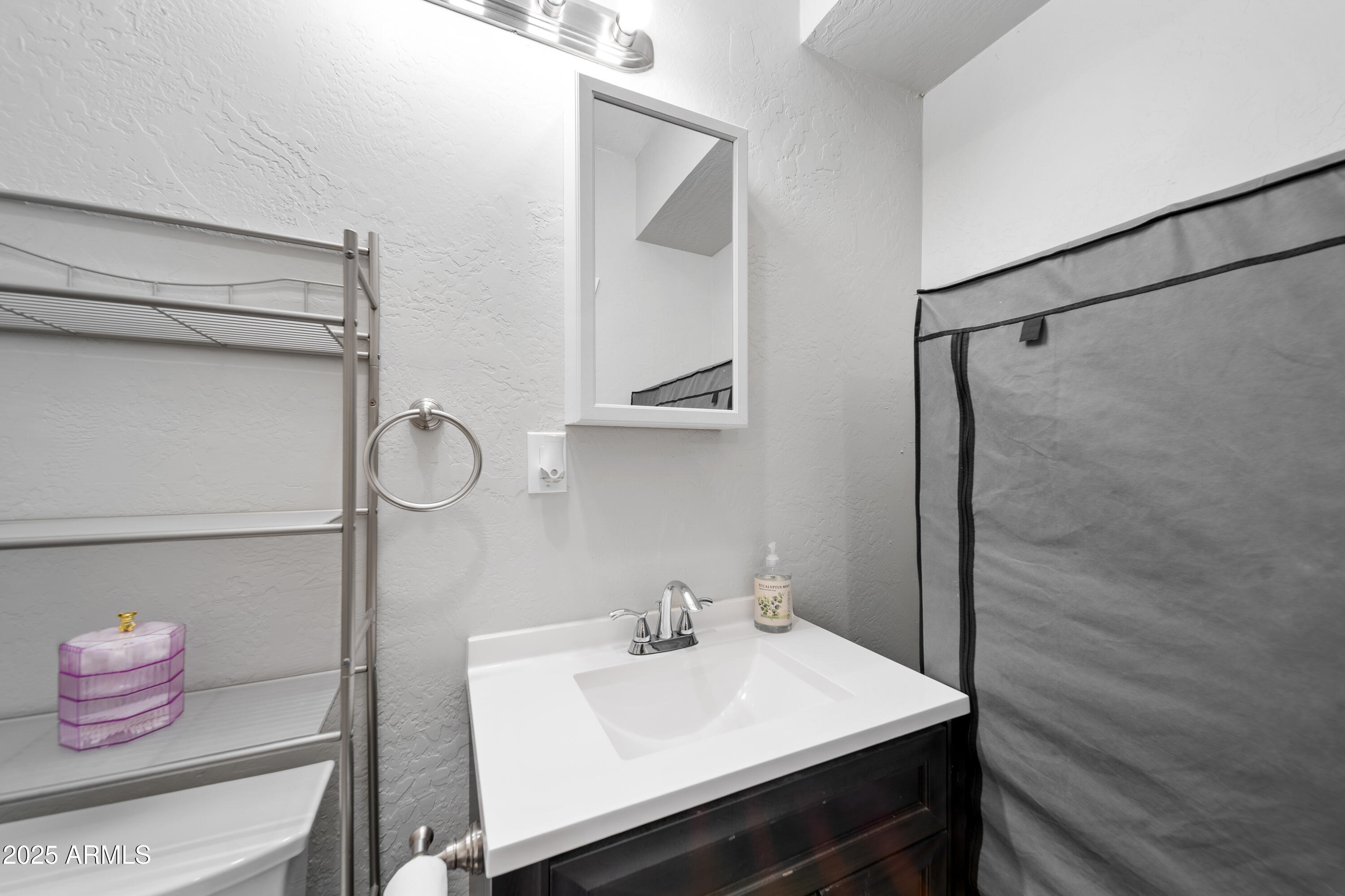 1898 Highway 260 Overgaard, AZ 85933 - Photo 18 of 38 a bathroom with a sink and a mirror