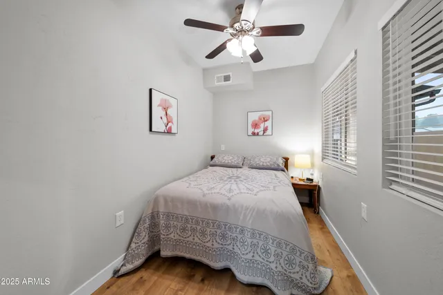 a view of bedroom with a bed and a window