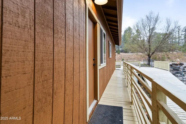 a view of a deck with wooden floor and seating space