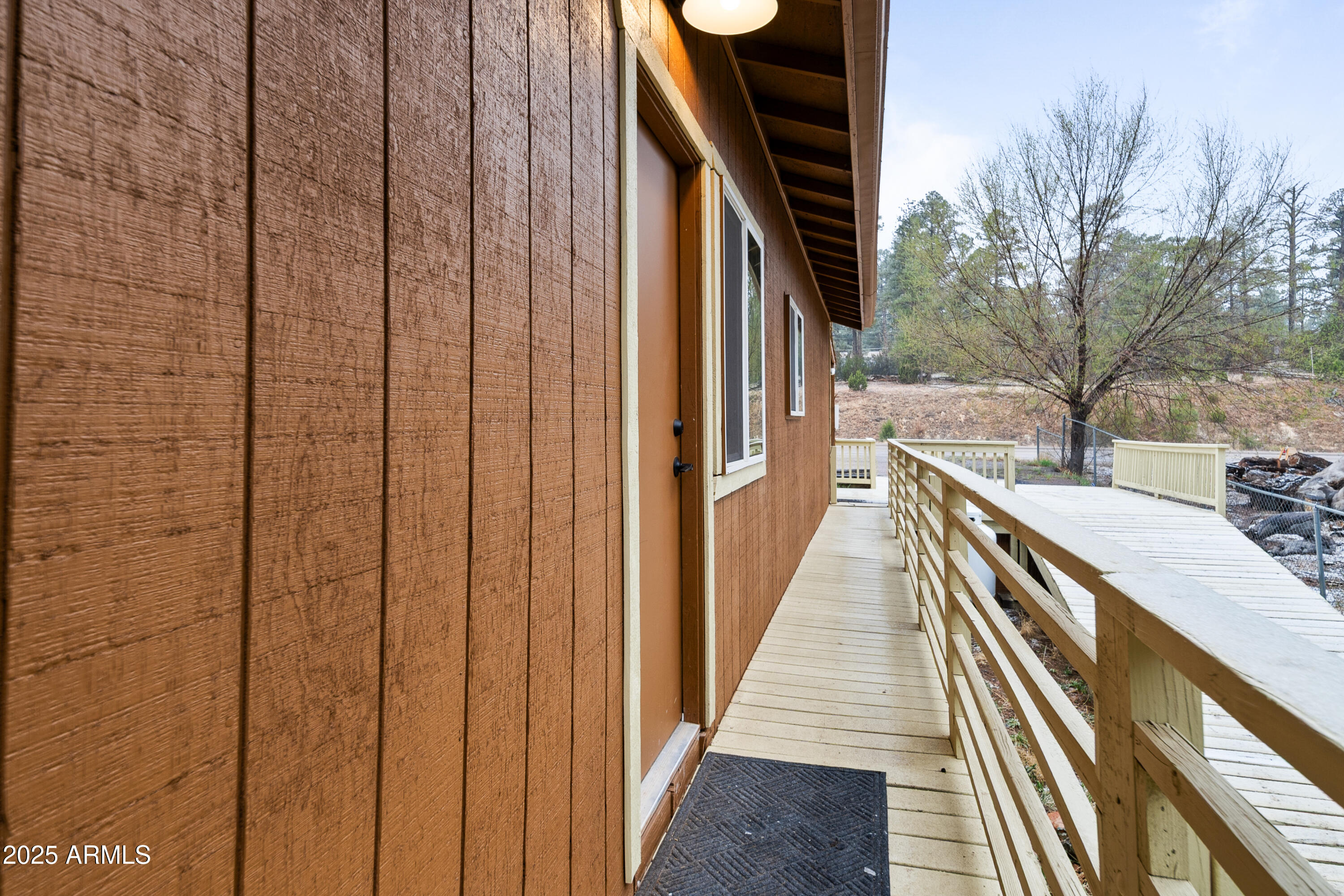 1898 Highway 260 Overgaard, AZ 85933 - Photo 31 of 38 a view of balcony with wooden floor and fence