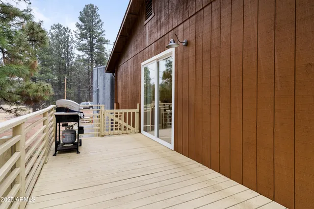 a view of a balcony with yard