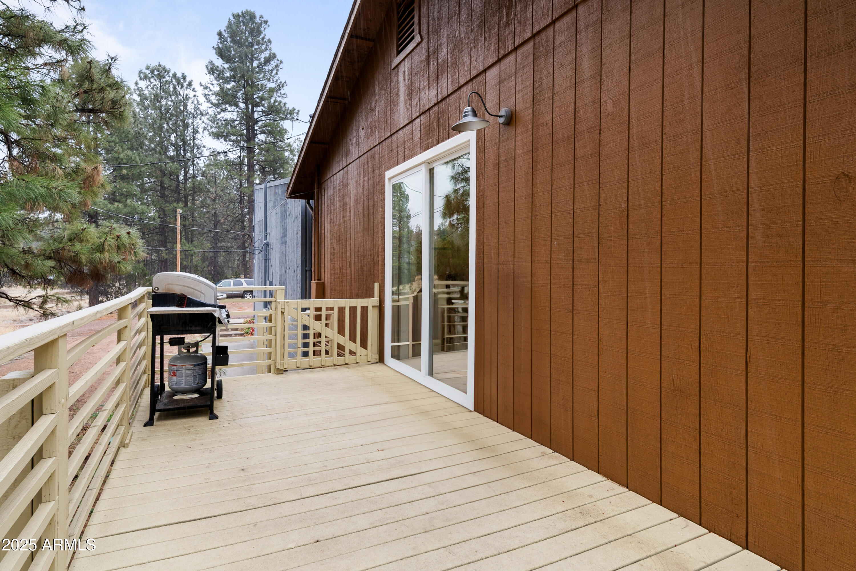 1898 Highway 260 Overgaard, AZ 85933 - Photo 32 of 38 a view of a deck with wooden floor and seating space