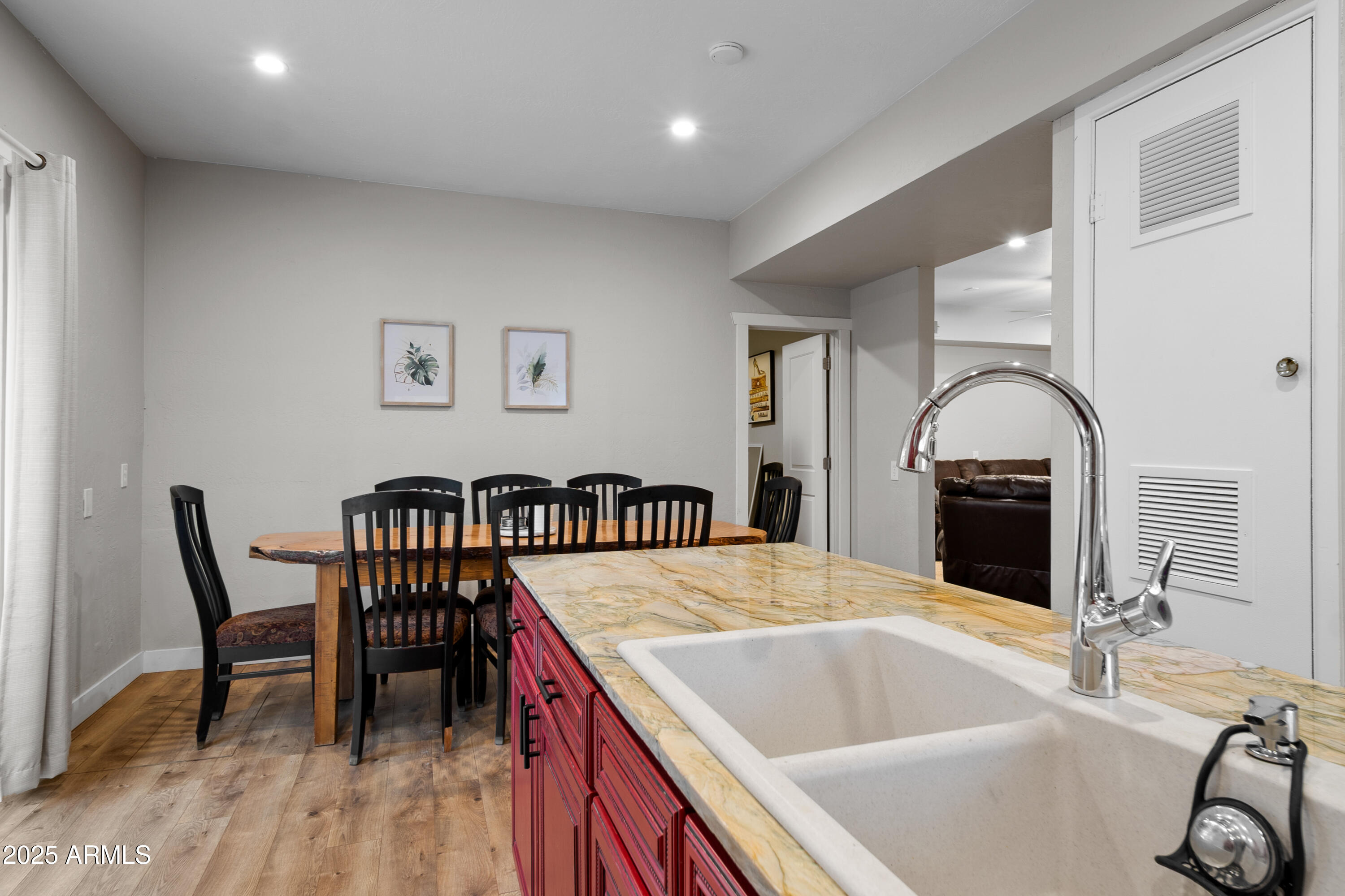 1898 Highway 260 Overgaard, AZ 85933 - Photo 6 of 38 a kitchen with a table chairs and a wooden floor
