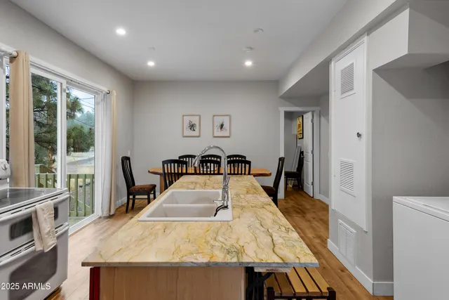 a bed sitting in a room next to a window