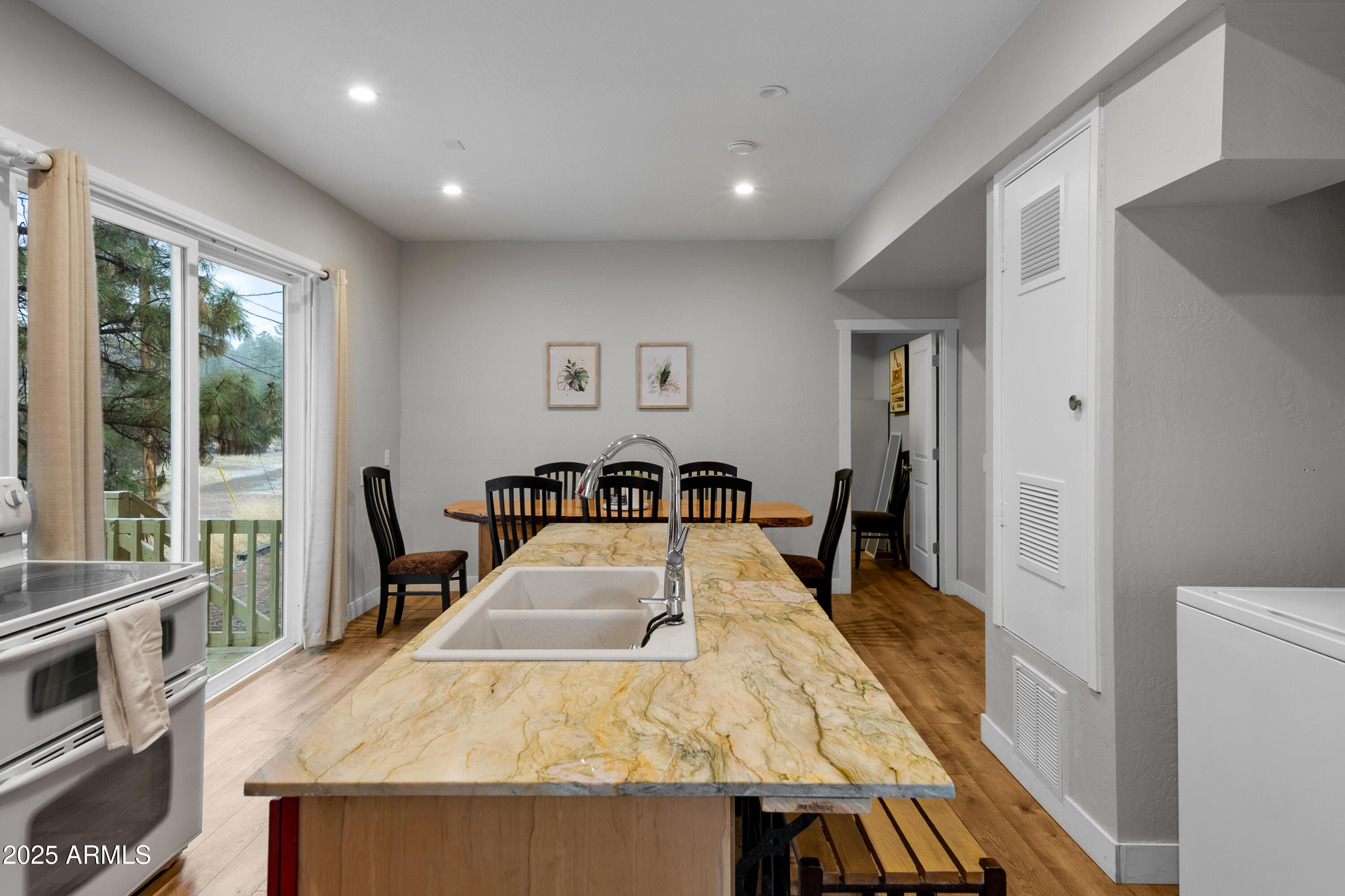 1898 Highway 260 Overgaard, AZ 85933 - Photo 7 of 38 a bed sitting in a room next to a window