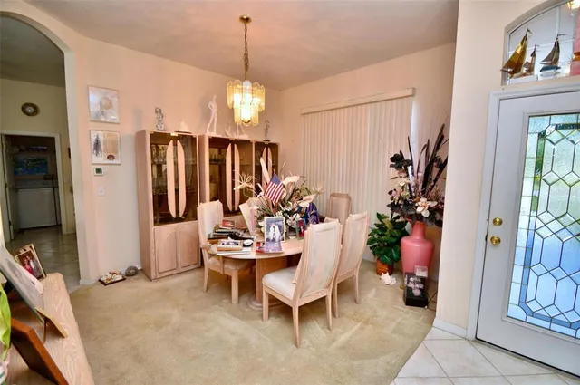 a view of a livingroom with furniture and front door