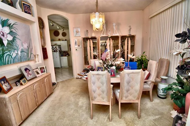 a dining room with furniture and window