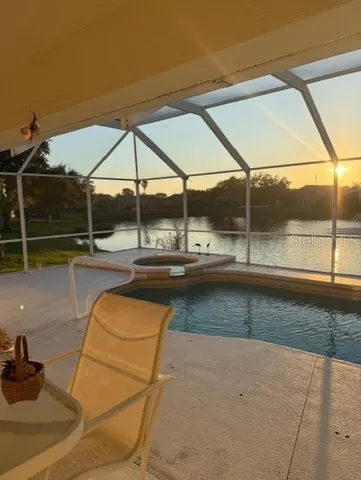 a view of swimming pool with outdoor seating
