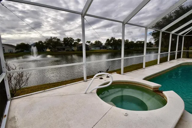a view of outdoor sitting area with lake view