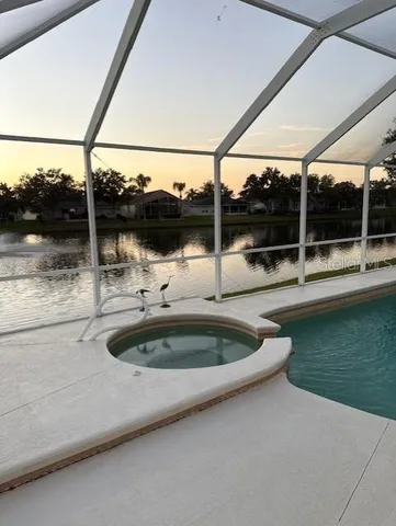 a view of a swimming pool with a patio