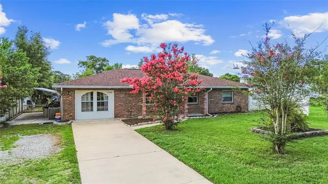 a front view of a house with yard