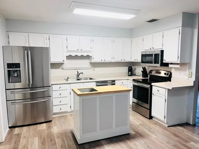 a kitchen with a stove and a microwave