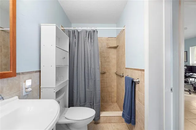 a bedroom with furniture and a chandelier