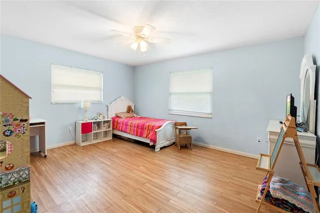 a bathroom with a toilet a sink and a mirror