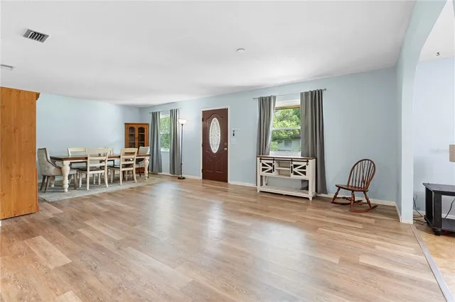 a view of a livingroom with furniture and wooden floor