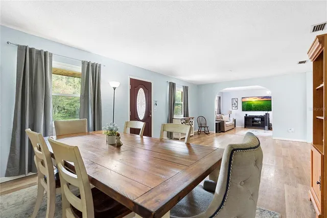a view of a livingroom with furniture and a hardwood floor