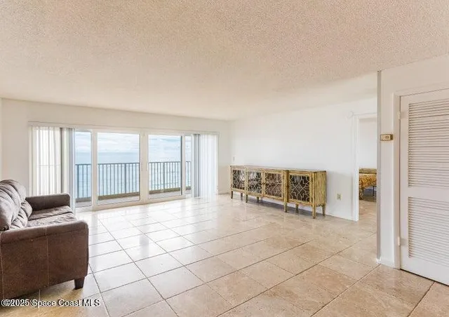 a very nice looking room with a large window and chair