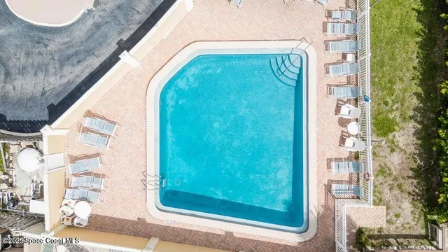 a view of swimming pool from a balcony