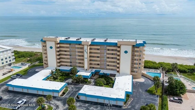 a view of a patio with table and chairs and potted plants